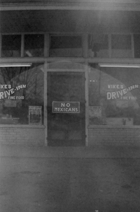 A restaurant with No Mexicans sign posted on the glass front door, Corazón de Dixie: Mexicanos in the U.S. South since 1910