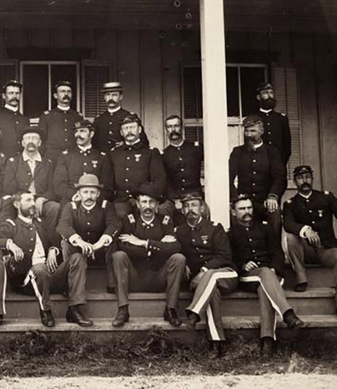 Cavalry officers seated on steps of a building at Fort Lewis, Colorado. Frazier Boutelle at right., Frazier A. Boutelle photographs, c. 1865-1924