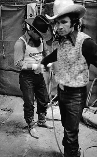 Two men behind a gate at a rodeo, Grayson Mathews (1948-2007) photographs, 1970s-1990s