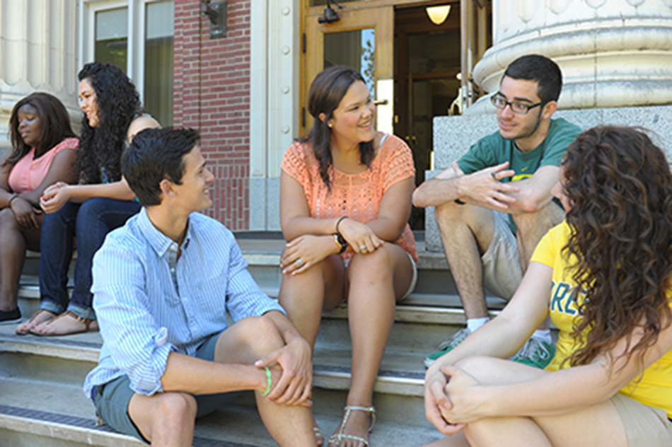 Students relaxing outside the Presidents offices in Johnson Hall, Marketing Communications Photo Archive