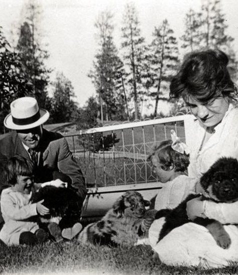 Black and white image of a man and woman with children and dogs., Opal S. Whiteley (1897-1992) photographs