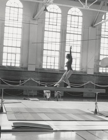 An OSU gymnast performs in the Womens Building, 1969, Oregon State University Athletics