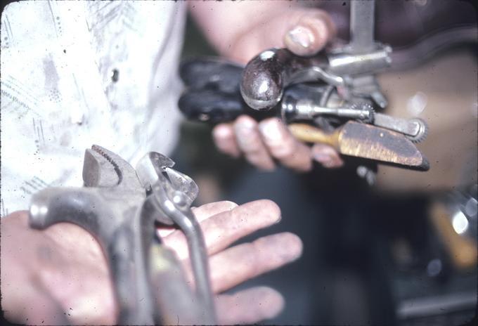 Mr. Thomas Palmer holding standard tools of trade, received from Jones