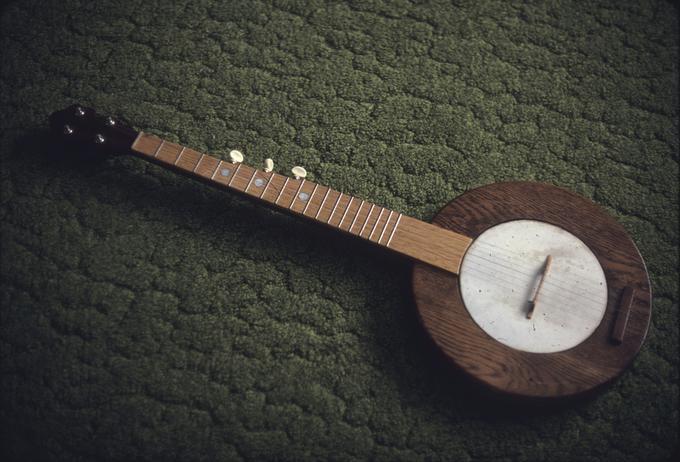 Three drone stringed, left handed banjo