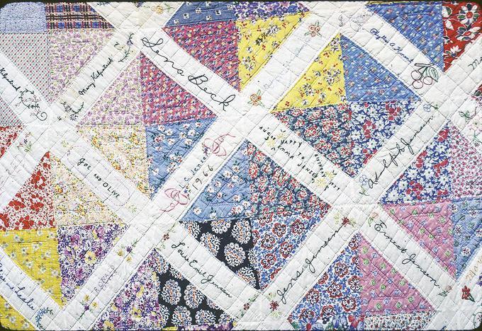 65 x 85 inch started by Emma Jensen's daughter in Can.(?). Sent squares to family and friends, got pieces back for Emma Jensen's birthday in 1939 but never got around to quilt it. Hattie and Marguerite quilted it about 1955. (Don't know why 1966 is on it.) Junction City