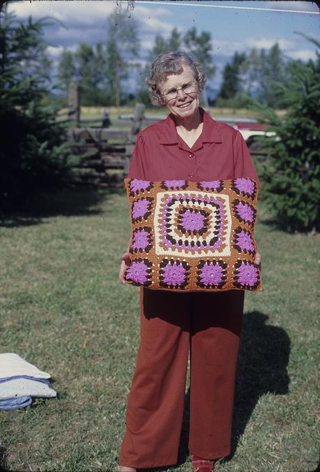 19 inch crocheted pillow of gray(?) squares(?)