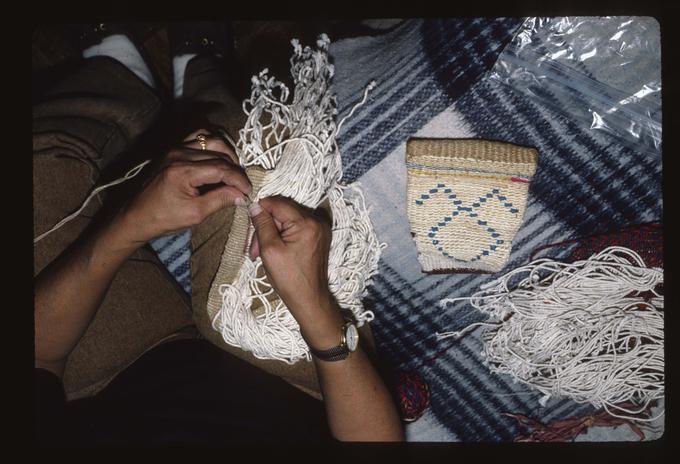 Master Artist Francis Brunoe working on basket