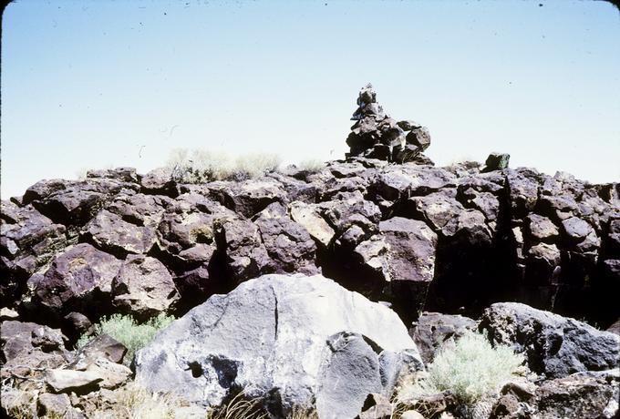 Single monument shaped like chair from distance