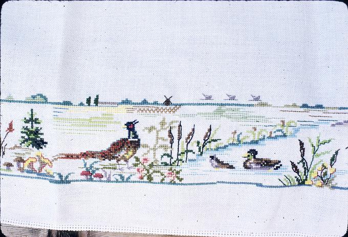 37 x 16 inches. Around 1969, Halsey-cross stitch outdoors scene