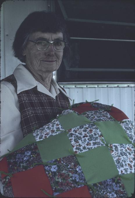 Mrs. Locke with patch quilt