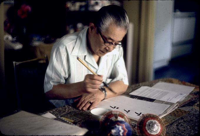 Ben Kasubuchi demonstrating sumi calligraphy