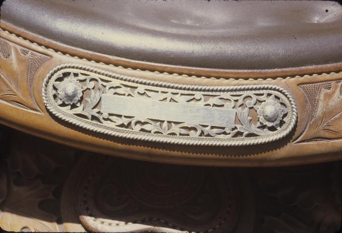 Mrs. Wood's saddle, detail of name plate on cantle