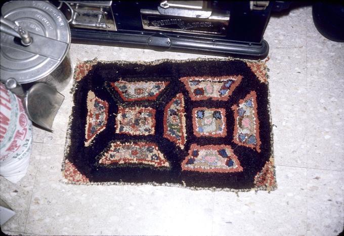 Early rag rug in museum kitchen