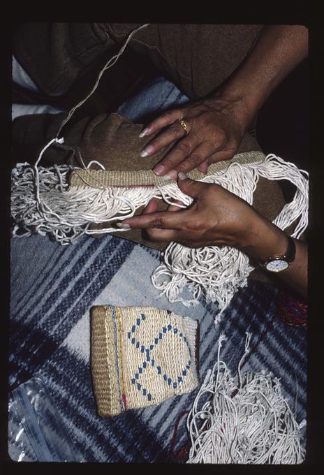 Master Artist Francis Brunoe working on basket