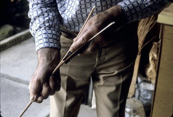 Splitting willow to use in making a Venetian basket, or wrapping a handle