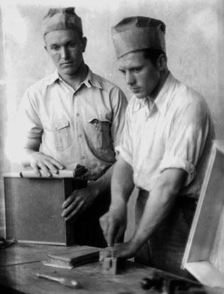 Carpentry Shop, Berea College: two students building cabinets