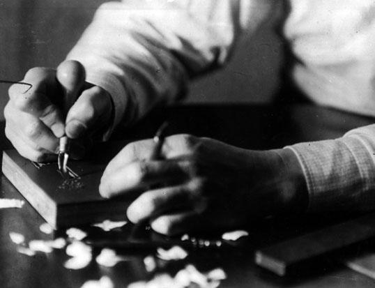 Hands of John Jacob Niles, carving wood block