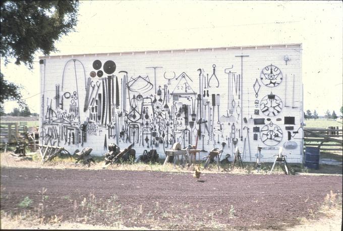 Full side of barn with artifacts hanging