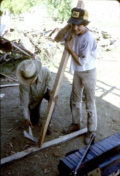 Mr. Michael Hanely and nephew, Hanley shaping point of tooth with ax