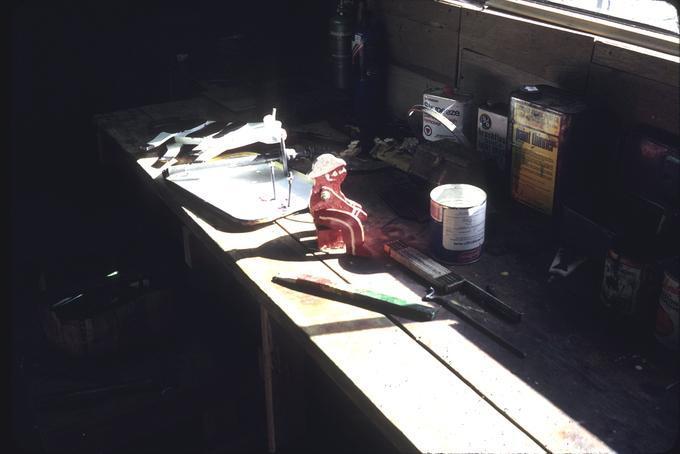 Workbench with parts for milker and cow windmill