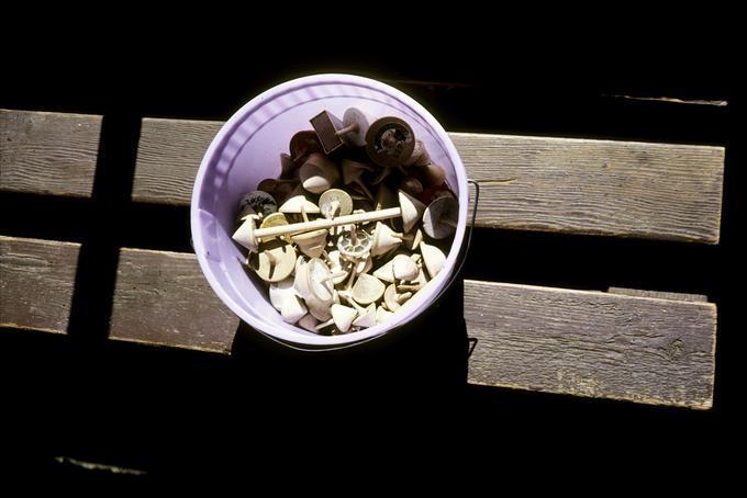 Bucket of completed tops plus one pair in progress