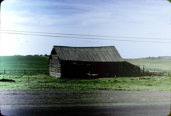 General view, front of Log Barn from State Highway 82