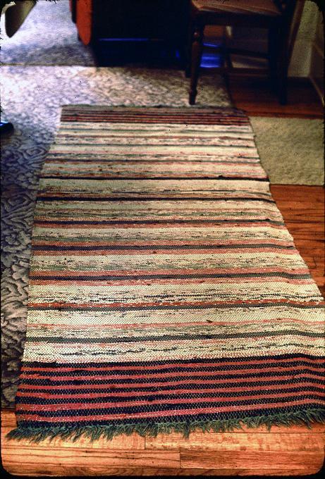 31 x 43 inch cotton woven rug, and 85 x 32 inch cotton woven rug. Made by Mrs. Peterson in 1950s in St. Helen's