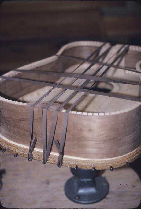 Guitar body on glue drying stand