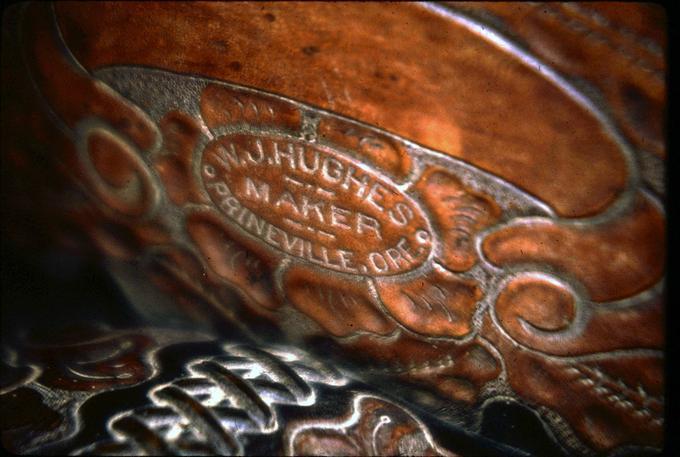 Saddle by Hughes, detail of cantle with maker's name