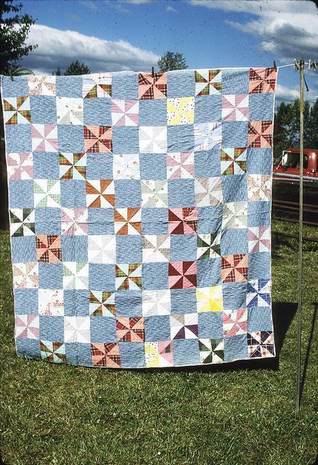 77 x 69 inch Hattie and Emma made blocks together and quilted it together, around 1939. Made it because didn't have much quilts and needed some. Made here in Junction City.