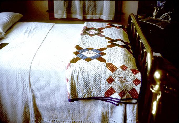 Bed with quilt, second example