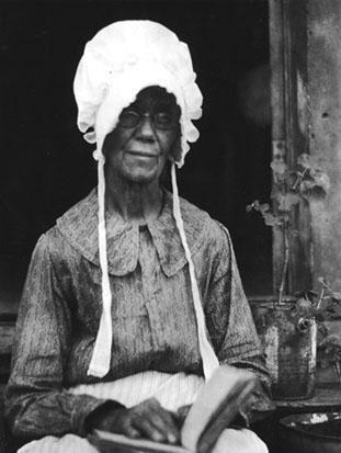 Elderly African-American woman, wearing bonnet