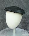 Saucer-style hat of black straw with black satin ribbon with flat bow in front