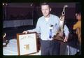 Lyle Wachsnicht holding Sweepstakes trophy, Mid Valley Coin Club meeting, Corvallis, Oregon, 1971