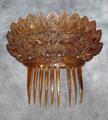 Hair comb of carved tortoiseshell with nine teeth (one missing)