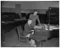 Music professor Jack O'Conner and an unidentified piano student, February 1954
