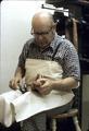 Series showing how Mr. Saller bastes by nail the leather to the sole (or cast)