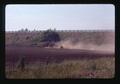 Dust behind tractor near Interstate 5, Oregon, June 1974