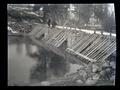 Men standing on spillway