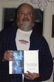 Portrait of Chuck Williams holding his book Bridge of the Gods, Mountains of Fire: A Return to the Columbia Gorge