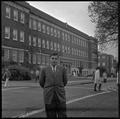 Gary Ford, a member of OSU's G.E. College Bowl team, posing outside of the Commerce Building