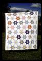 65 x 75 star quilt made with feed sack backs and nurses uniforms front, Marguerite Jensen made it, sister was the nurse! Around 1941 or 1942 or so here in Junction City