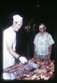 Henry Hagg observing steak barbecuing, Portland Chamber of Commerce Agriculture Picnic, Portland, Oregon, August 1969