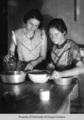 Two  women cooking