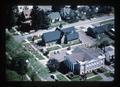Aerial view of gathering at Corvallis Art Center and adjacent funeral home, Corvallis, Oregon, 1976
