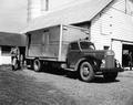 Roy C. Meyer loading milk truck on Walter Drager dairy farm, Gervais, Oregon