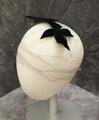 Hat of black net accented with tiny rhinestones and a pair pinwheel bows of black velour at crown