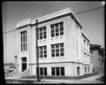 Sellwood School, Portland, with power lines and pole in foreground.