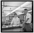 Jean Saubert, OSU student and Olympic skiing medalist, with a faculty member in the laboratory, July 1964