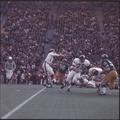A passing play develops during the 1969 Civil War football game